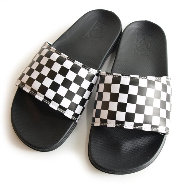 Vans black 2025 and white slides