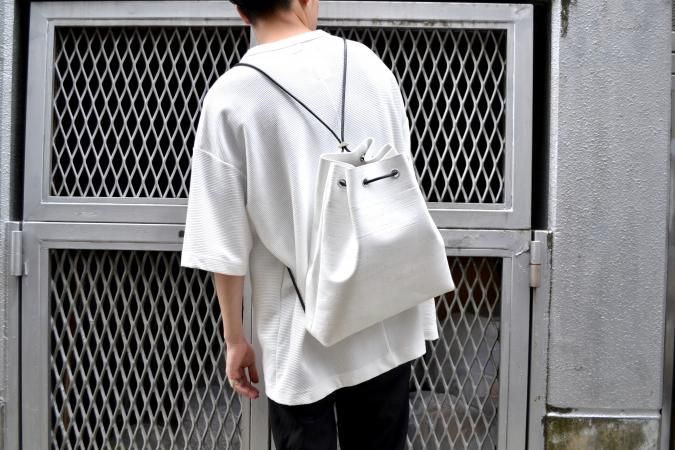 カガリユウスケ(KAGARI YUSUKE)の白壁 ナップサックの通販 カガリユウスケ(KAGARI YUSUKE)の白壁 ナップサックの通販