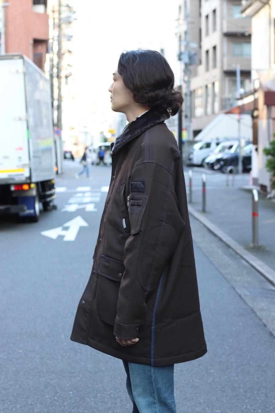 SHINYAKOZUKA(シンヤコズカ)のDOKA COAT WITH TORAICHI CHOCOLATEの ...