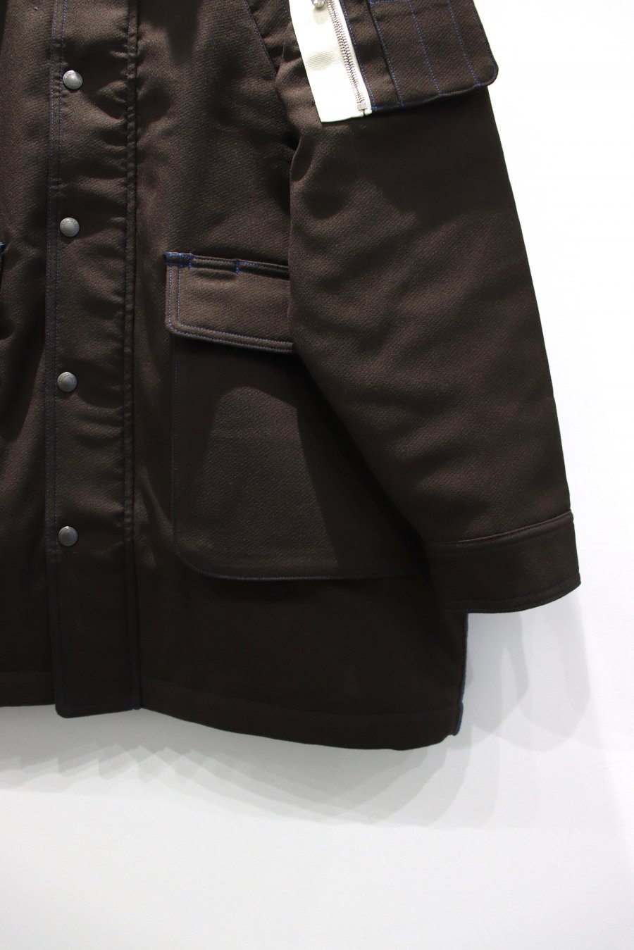 SHINYAKOZUKA(シンヤコズカ)のDOKA COAT WITH TORAICHI CHOCOLATEの ...